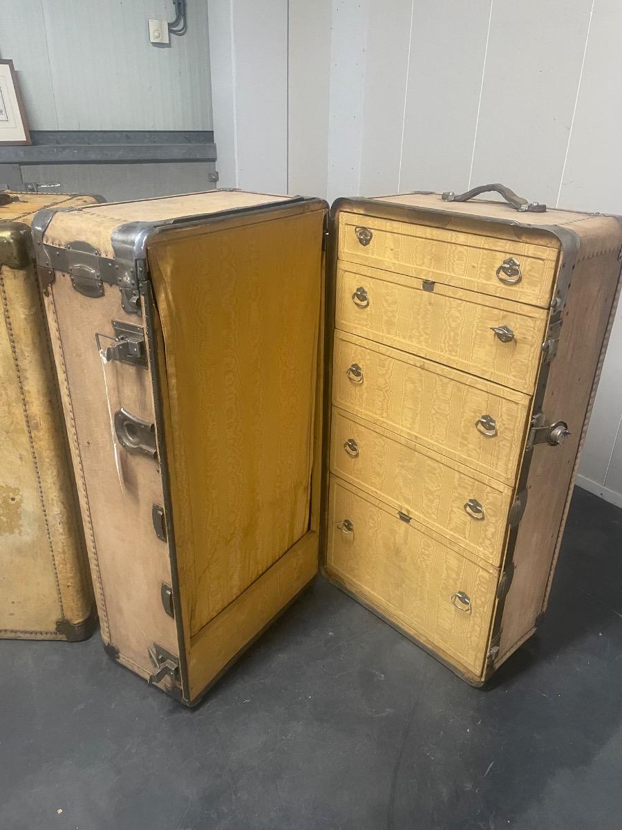 An unusual set of 4 suitcases