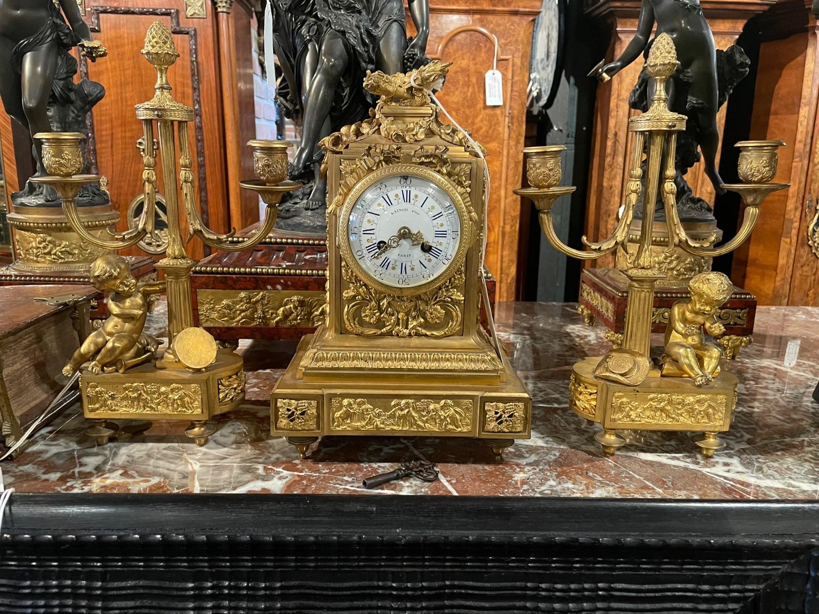 Bronze gilded clock set by Raingo Frères a Paris. 33cm high