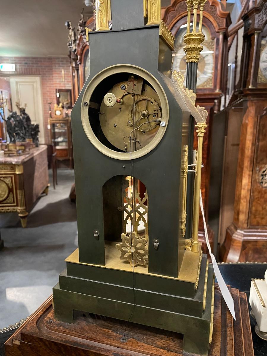 Bronze neo gothic cathedral clock with bell in top and gong in base. 64 cm tall