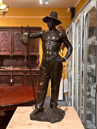 Bronze sculpture of a farmer signed by G. Devreese, 71h cm