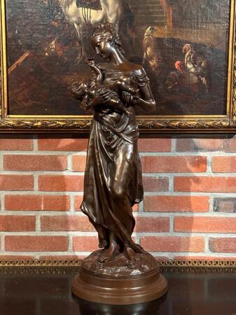Bronze Sculpture of a mother carrying her child signed by Adrien Gaudez and Auguste Moreau, 74h cm